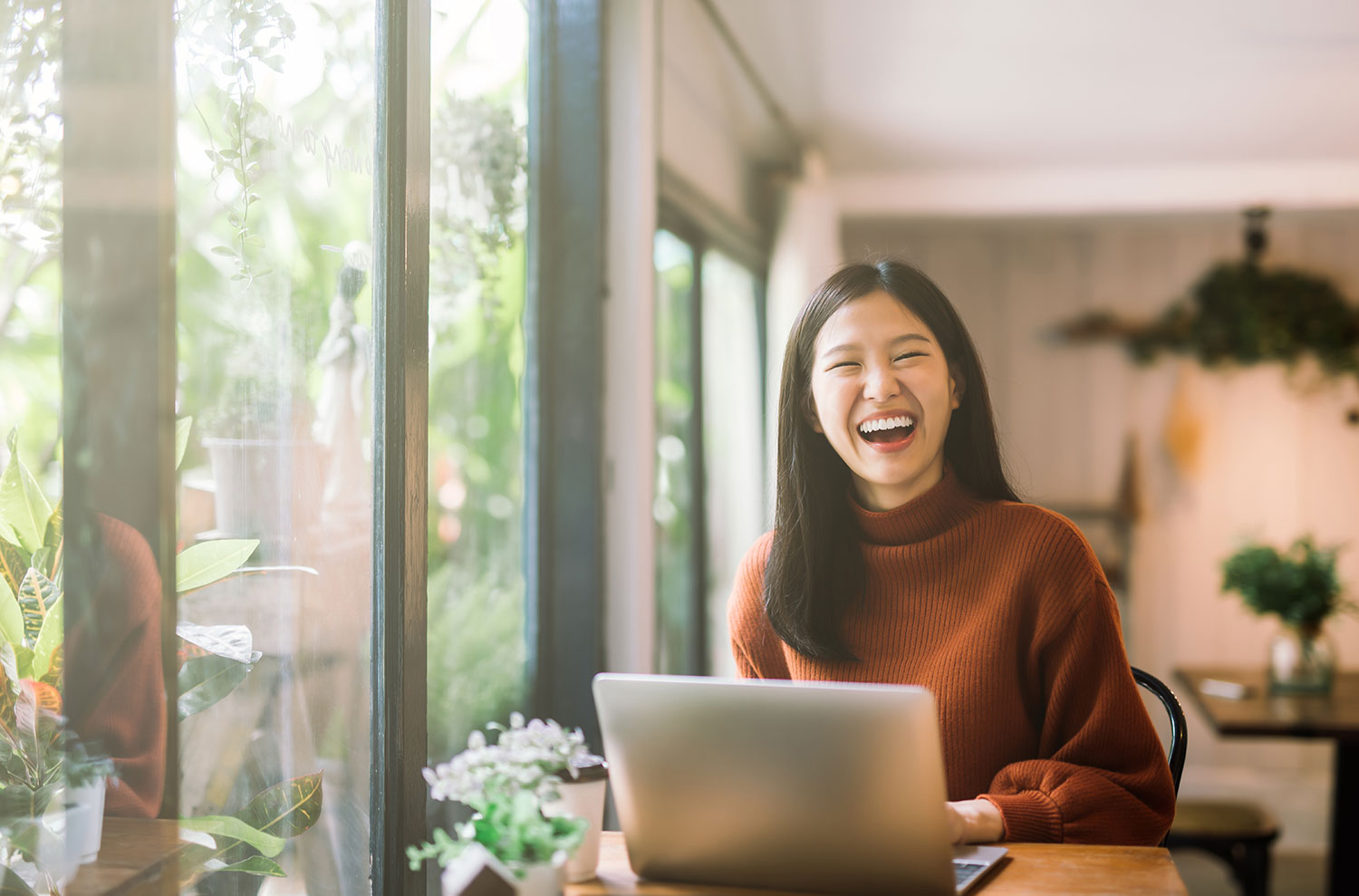 woman on computer smiling